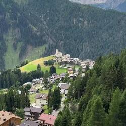 The church bells echo all the way up to trail — Colle Santa Lucia, Italy.