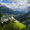 I love this view of the village church and the scenic background — Colle Santa Lucia, Italy.