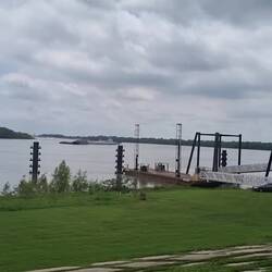 Watching sugar barges on Mississippi, on levee opposite Houmas House