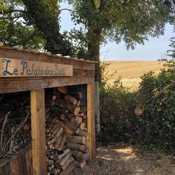 The sign for 'Les Palais des Bois' is painted and installed