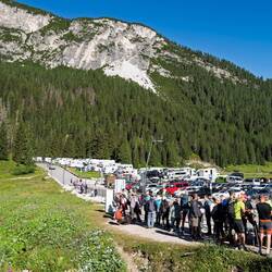 Find Mui in the Dolomiti Bus queue near the parking lot.