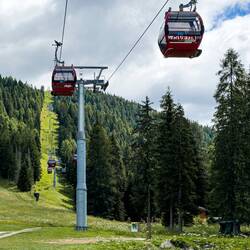 Gondolas heading up on the next part of the funivia — Piani di Pezzè, Civetta Ski Area.