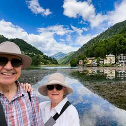 Along the lakefront promenade; Col di Lana in the center — Alleghe, Italy.