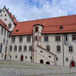 The Hohes Schloss. The illusionist window painting dates from around 1500