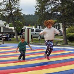 Emalyn and Dean bouncing at the KOA campground