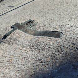 This monument in the middle of the pavement, marks the spot a student set fire to himself in protest