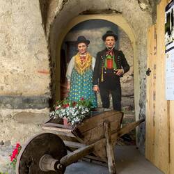 A Ladin couple at the entrance to the Ladin Institute at Cesa de Jan — Colle Santa Lucia, Italy.