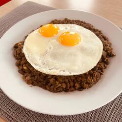Arrival lunch: yesterday's daal with fried eggs. Not up for cooking yet.
