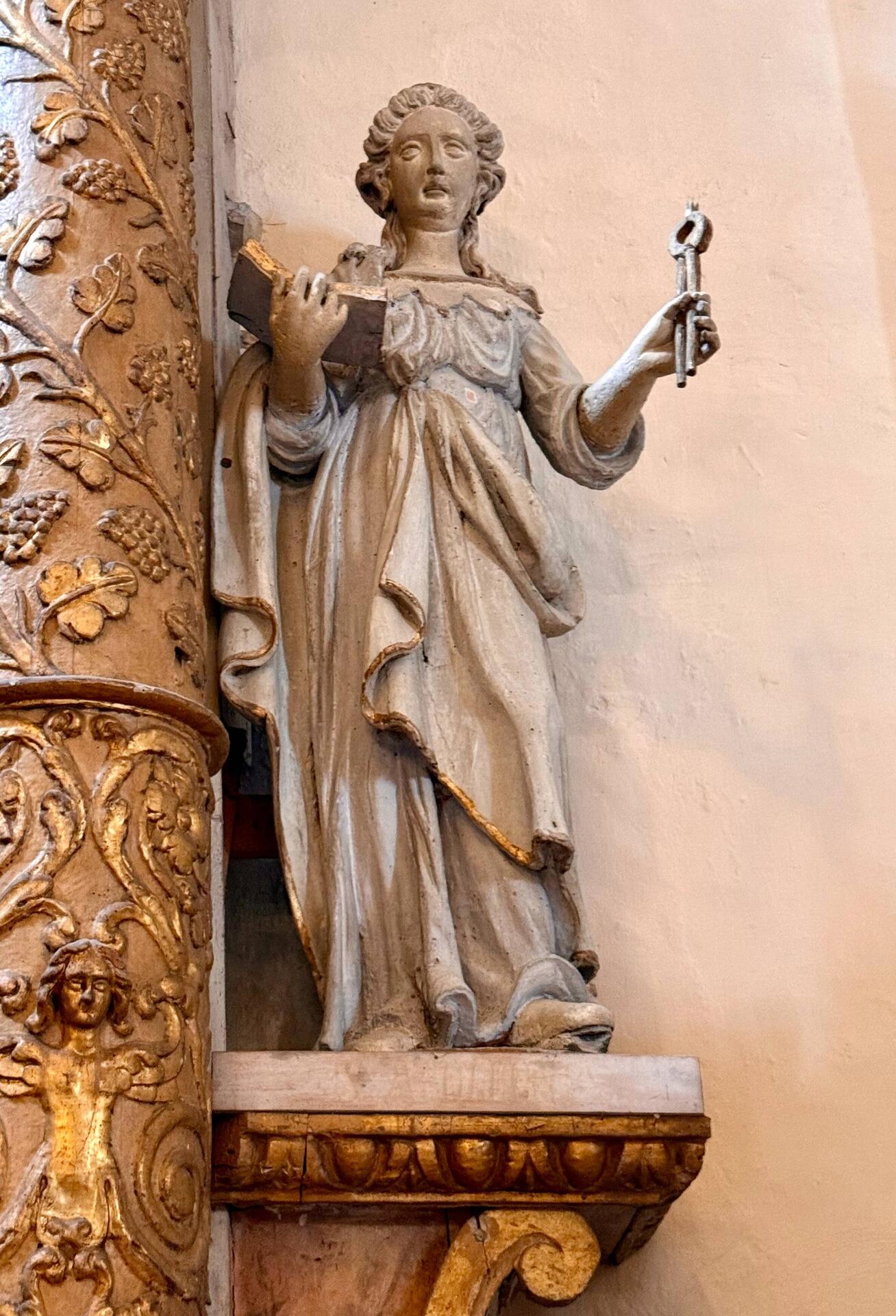 Angel with a book and a key to heaven