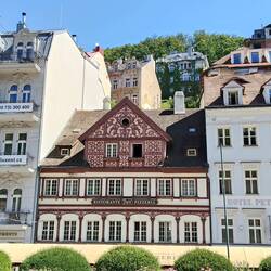 The little building was built first and in a different style than the later ones.
