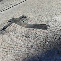 This monument in the middle of the pavement, marks the spot a student set fire to himself in protest