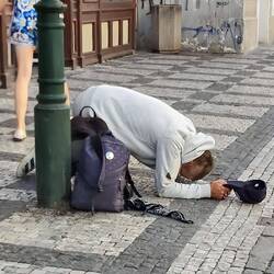 This is the pose the beggars take around here.