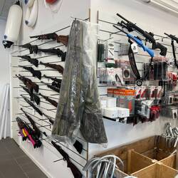 In the harbor store among fenders and anchors.