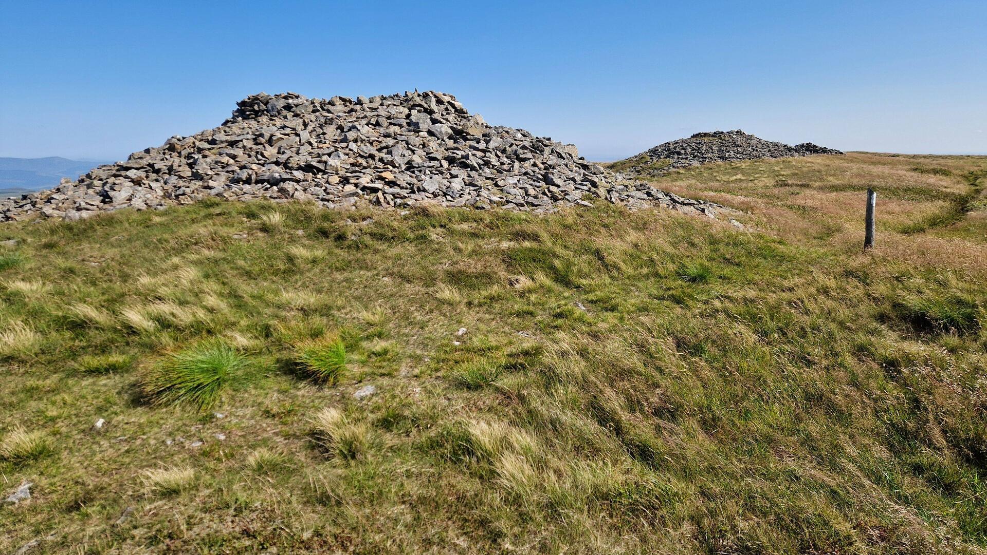 Pair of piles of stones atop Pen Pumlumon Arwystli