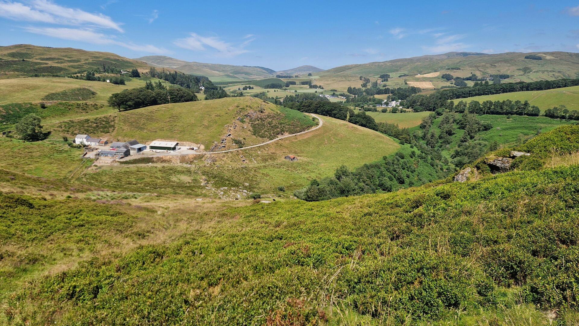 From Bryn Bas mountain looking north towards Ponterwyd. Bryn-Brâs farm in the left foreground