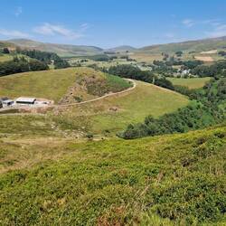 From Bryn Bas mountain looking north towards Ponterwyd. Bryn-Brâs farm in the left foreground