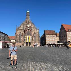 The Hauptmarkt, Frauenkirche in the background, old man in the foreground