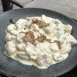 Chestnut-potato gnocchi with "mountain cheese fonduta" and truffle. Dreamy.