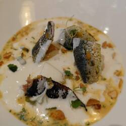 Sardines on peach cubes with ajo blanco (almond soup) - delicious