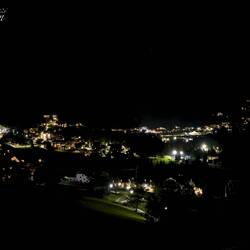 Nightfall veils all but the twinkling lights of the town ... from Chalet Cogolara — Colfosco, Italy.