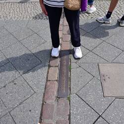 One foot in the east, one foot in the west