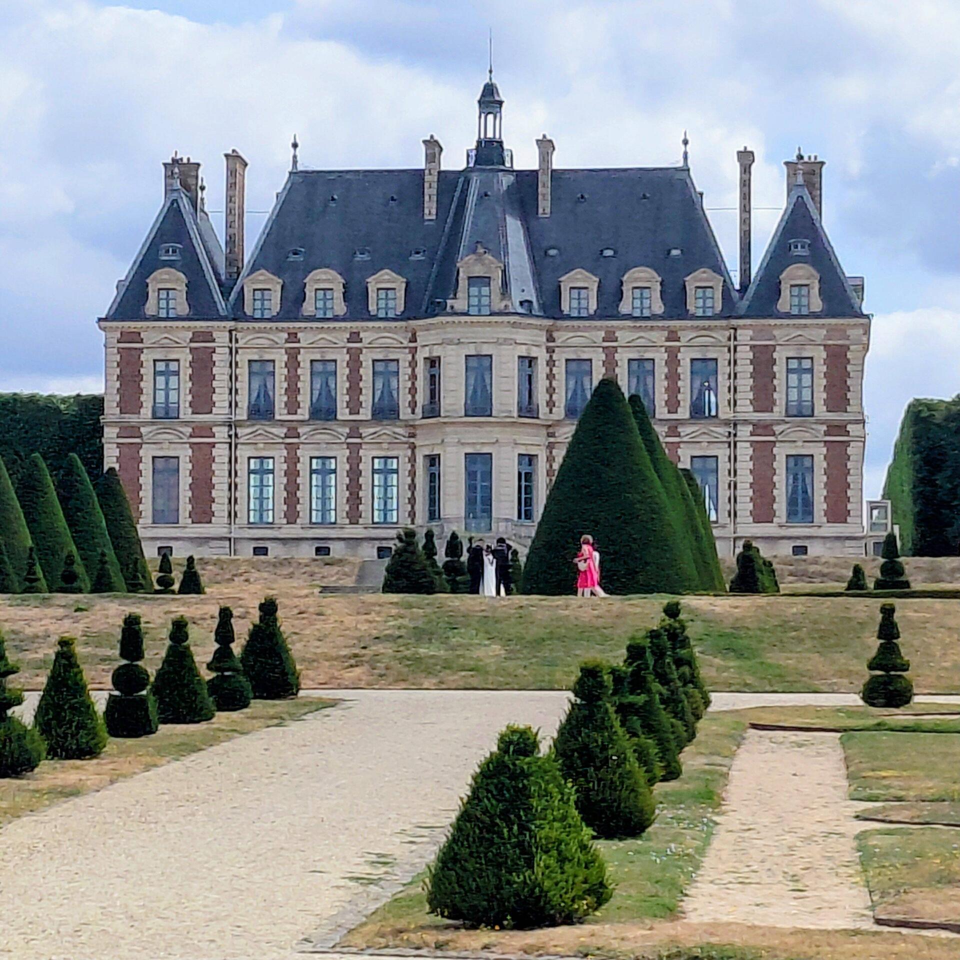 There was a bride having photos taken in the distance and 'the lady in red'