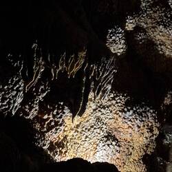 Jewel Cave. Calcites covered in mud