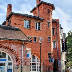 Fabulous brickwork and intriguing windows, part of the front entrance to the pool