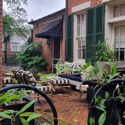 A cute outdoor area between two very close homes