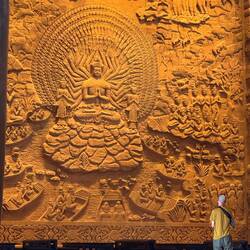 Huge detailed stone reliefs on all walls depict the life of Buddha. Carved by Indonesian artisans.