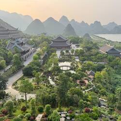 The three temples in the gloaming. Wings of masses of dragonflies above shone golden in the light.
