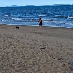 Sam running with her new puppy. Thor
