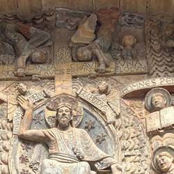 Above Christ's head, we see the cross of the crucifiction, Jesus, King of the Jews,