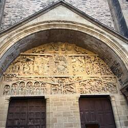 Detail. Christ enthroned at Tympanum's center. The elect to his right angels to right.