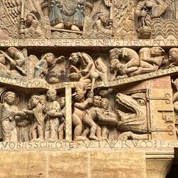 At the foot of Christ's throne, Saint Michael, the Archangel and Lucifer weigh souls.