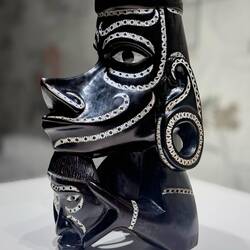 A carved ebony canoe figurehead representing ancestral deities ... from the Solomon Islands — MuNe.