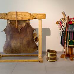 Khökhüüri to churn fermented mare's milk (L); dairy bucket; & horse saddle ... presented by Mongolia