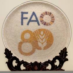 Made by a FAO GIAHS site in China; the 80th anniversary plate is inlaid with 10,000+ local pearls.
