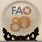 Made by a FAO GIAHS site in China; the 80th anniversary plate is inlaid with 10,000+ local pearls.