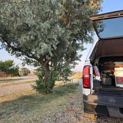 Our tree is on the wrong side for shade so sitting in the shade of the camper.
