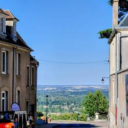 The other end of the street looks over the vineyards below