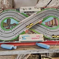 I remember someone having a slot car thing like that when I was a kid