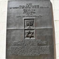 Plaque on rebuilt synagogue honoring Jews rounded up and taken to concentration camps