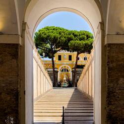View through one of the arches on the ground floor entrance of Palazzo Barberini — Roma, Italy.