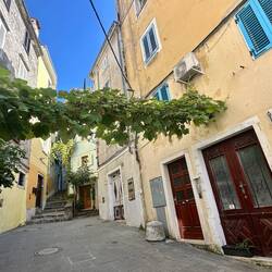 Our studio small red door on the right, with blue shutters.