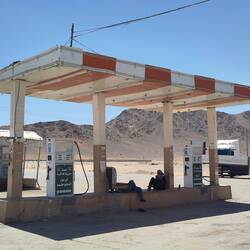 RidingKismet hiding in the shade at a petrol station, somewhere nowhere