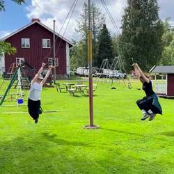 Twins swinging