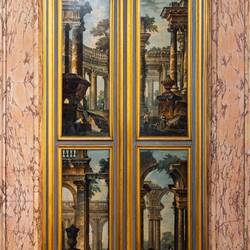 Door in the First Gallery with scenes from Roman ruins (Piazza Pietro; 1736-38) — Palazzo Corsini.