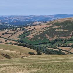 View north over Llanddeusant and beyond from Cefn Nant Lygos part way up the moorland