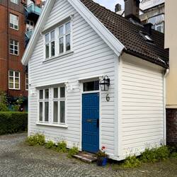 Cute little cottage next to the apartment building — Bergen, Norway.